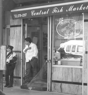 Cop and Fish guy, taken whilst stuck in Manhattan traffic jam